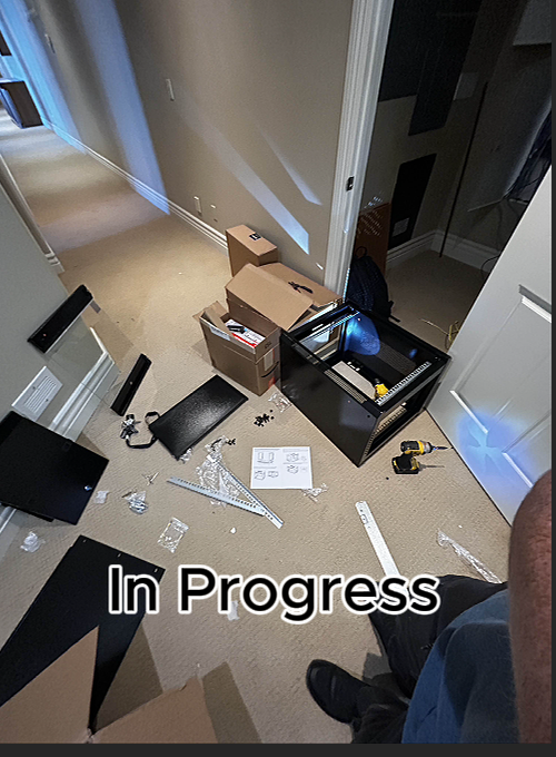 Video playing with 'In Progress' text overlay on a room setup.